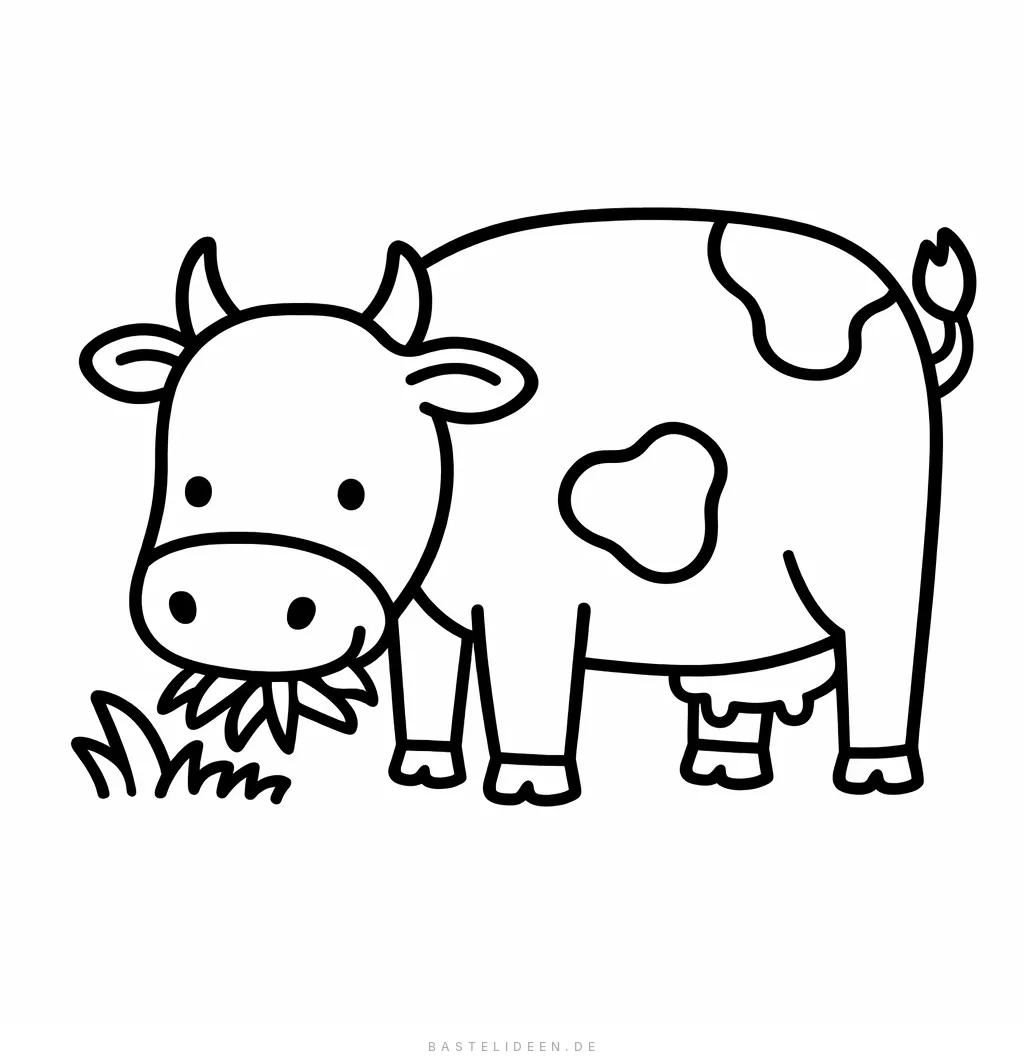 Kuh mit gesenktem Kopf beim Grasen auf der Wiese